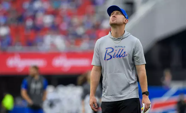 Buffalo Bills head coach Joe Brady looks around the stadium during practice at the team's NFL football training camp Saturday, Aug. 8, 2026, in Orchard Park, N.Y. (AP Photo/Adrian Kraus)