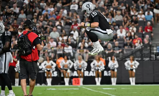 Las Vegas Raiders quarterback Fernando Mendoza warms up on the field during the first half of a preseason NFL football game against the Arizona Cardinals, Thursday, Aug. 13, 2026, in Las Vegas. (AP Photo/David Becker)