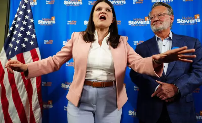 Rep. Haley Stevens, D-Mich., left, a candidate in the Democratic primary for U.S. Senate in Michigan, accompanied by Sen. Gary Peters, D-Mich., speaks during a campaign event at the UA Local Plumbers 98 Union Hall, Sunday, Aug. 2, 2026, in Madison Heights, Mich. (AP Photo/Julia Demaree Nikhinson)
