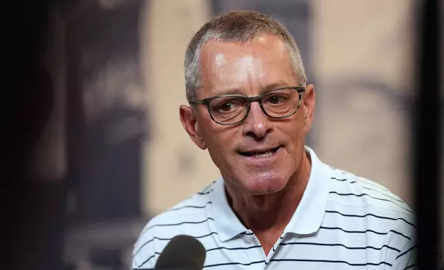 Denver Broncos co-owner and chief executive officer Greg Penner talks to reporters at the team's NFL football training camp in Centennial, Colo., Tuesday, Aug. 11, 2026. (AP Photo/David Zalubowski)