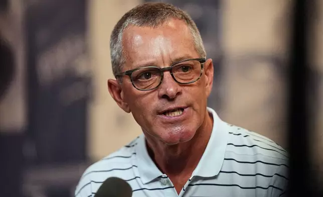Denver Broncos co-owner and chief executive officer Greg Penner talks to reporters at the team's NFL football training camp in Centennial, Colo., Tuesday, Aug. 11, 2026. (AP Photo/David Zalubowski)