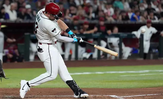 Arizona Diamondbacks' Tim Tawa connects for a three-run home run against the San Diego Padres during the fourth inning of a baseball game, Monday, Aug. 3, 2026, in Phoenix. (AP Photo/Ross D. Franklin)