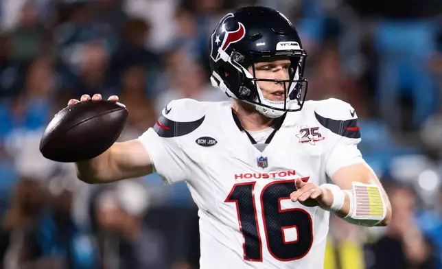 Houston Texans quarterback Brett Rypien passes against the Carolina Panthers during the second half of an NFL preseason football game, Friday, Aug. 28, 2026, in Charlotte, N.C. (AP Photo/Scott Kinser)