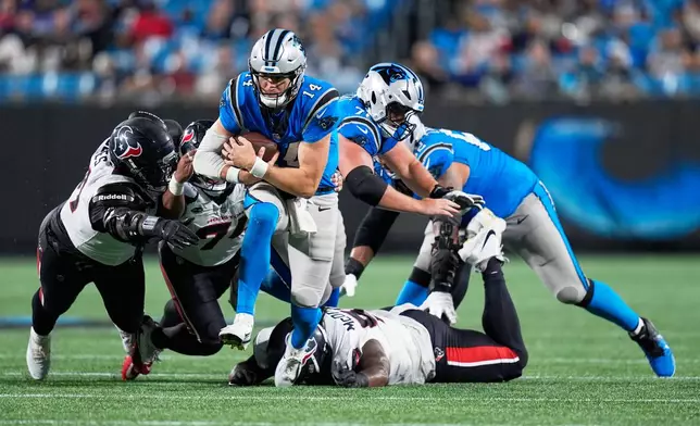 Carolina Panthers quarterback Kyle Trask runs against the Houston Texans during the first half of an NFL preseason football game, Friday, Aug. 28, 2026, in Charlotte, N.C. (AP Photo/Erik Verduzco)