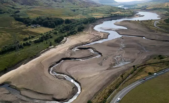 FILE - Woodhead reservoir is visible amid a drought near Manchester, England, Thursday, Aug. 13, 2026. (AP Photo/Jon Super, File)