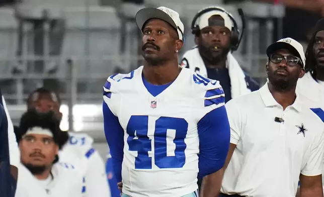 Dallas Cowboys linebacker Von Miller (40) watches play against the Arizona Cardinals in the first half of a preseason NFL football game Saturday, Aug. 22, 2026, in Glendale, Ariz. (AP Photo/Rick Scuteri)