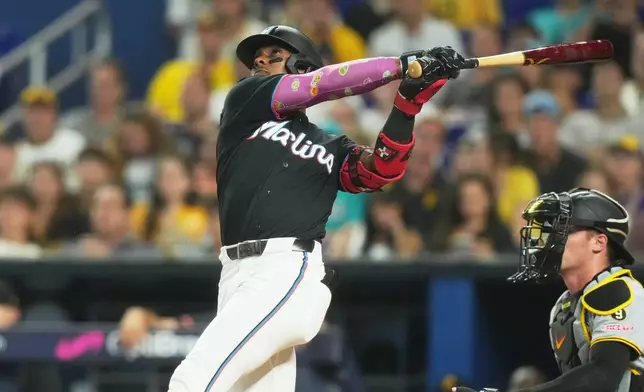 Miami Marlins' Esterury Ruiz hits a home run during the third inning of a baseball game against the Pittsburgh Pirates Tuesday, Aug. 11, 2026, in Miami. (AP Photo/Marta Lavandier)