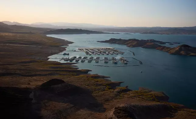 FILE - Boats are moored at a marina on Lake Mead amid a droughtnat the Lake Mead National Recreation Area near Boulder City, Nev., June 30, 2026. (AP Photo/John Locher, File)