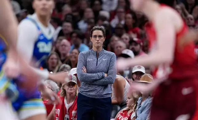 Indiana Fever head coach Stephanie White watches from the sideline in the second half of a WNBA basketball game against the Dallas Wings in Indianapolis, Friday, Aug. 14, 2026. (AP Photo/Michael Conroy)