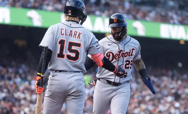 Detroit Tigers' Gleyber Torres, right, is congratulated by Max Clark (15) after scoring against the San Francisco Giants during the sixth inning of a baseball game, Saturday, Aug. 8, 2026, in San Francisco. (AP Photo/Jeff Chiu)