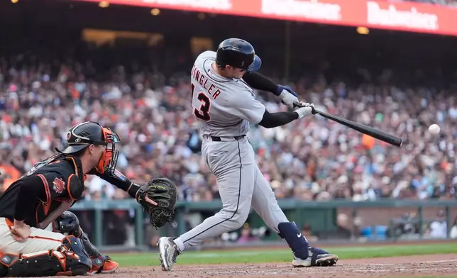 Detroit Tigers' Dillon Dingler, right, hits an RBI double next to San Francisco Giants catcher Daniel Susac during the seventh inning of a baseball game, Saturday, Aug. 8, 2026, in San Francisco. (AP Photo/Jeff Chiu)