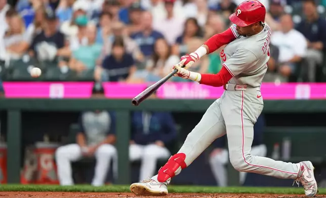 Philadelphia Phillies' Justin Crawford hits an RBI single during the second inning of a baseball game against the Seattle Mariners, Tuesday, Aug. 25, 2026, in Seattle. (AP Photo/Lindsey Wasson)