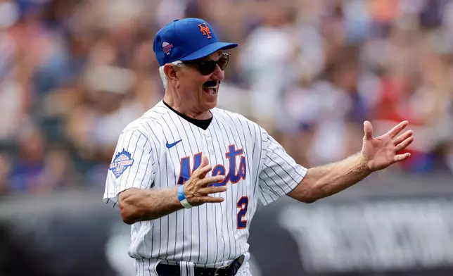 FILE - Former New York Mets' Bobby Valentine, wearing a fake moustache, reacts as he is introduced during an Old-Timers' Day ceremony before a baseball game between the Colorado Rockies and the Mets on Aug. 27, 2022, in New York. (AP Photo/Adam Hunger, File)