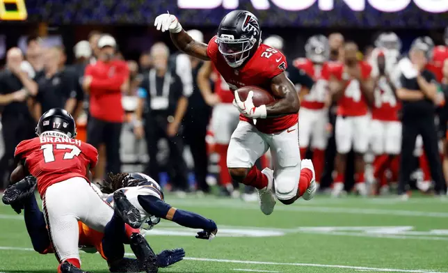 Atlanta Falcons running back Tyler Goodson (25) runs against the Denver Broncos during the first half of a preseason NFL football game, Friday, Aug. 14, 2026, in Atlanta. (AP Photo/Erik Lesser)