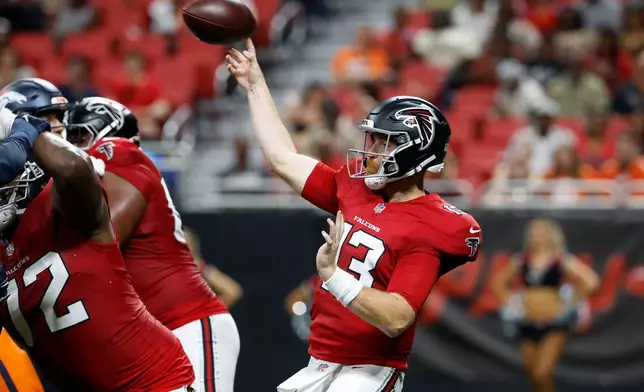 Atlanta Falcons quarterback Cooper Rush (13) passes during the first half of a preseason NFL football game, Friday, Aug. 14, 2026, in Atlanta. (AP Photo/Erik Lesser)