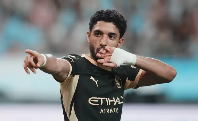 Manchester City's Omar Marmoush celebrates after scoring his side's opening goal during the preseason friendly soccer match between Manchester City and Atletico Madrid in Seoul, South Korea, Sunday, Aug. 9, 2026. (AP Photo/Lee Jin-man)