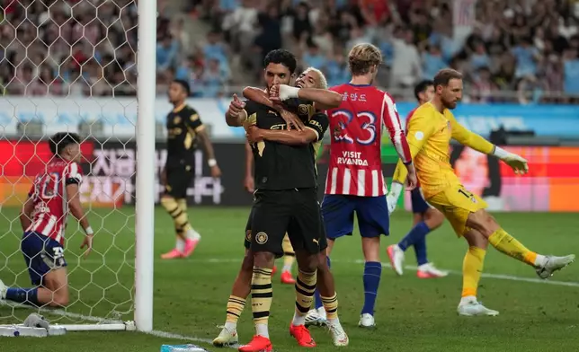 Manchester City's Omar Marmoush celebrates after scoring his side's opening goal during the preseason friendly soccer match between Manchester City and Atletico Madrid in Seoul, South Korea, Sunday, Aug. 9, 2026. (AP Photo/Lee Jin-man)