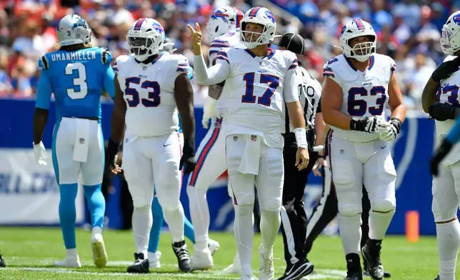 Buffalo Bills quarterback Josh Allen (17) signals for a first down after a penalty during the first half of a preseason NFL football game against the Carolina Panthers, Saturday, Aug. 15, 2026, in Orchard Park, N.Y. (AP Photo/Adrian Kraus)