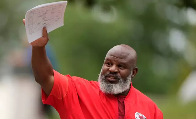 Kansas City Chiefs offensive coordinator Eric Bieniemy arrives at NFL football training camp Tuesday, Aug. 11, 2026, in St. Joseph, Mo. (AP Photo/Charlie Riedel)
