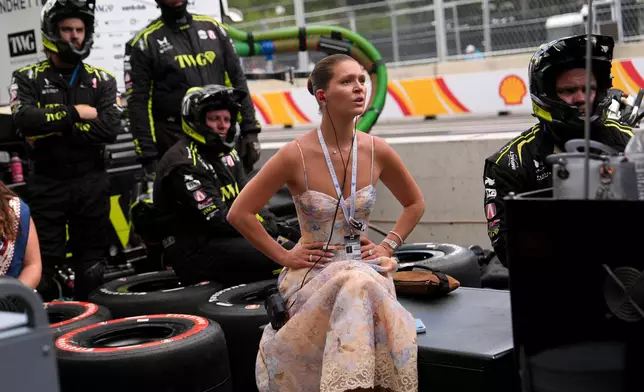 Cassidy Towriss watches the IndyCar Freedom 250 Grand Prix auto race, Sunday, Aug. 23, 2026, in Washington. (AP Photo/Julia Demaree Nikhinson)