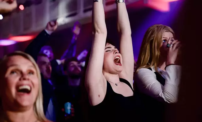 Supporters of the Yes campaign celebrate after Reykjavik results put their side into a narrow nationwide lead during an election-night gathering in Reykjavik, Iceland, Sunday, Aug. 30, 2026. (AP Photo/Marco Di Marco)