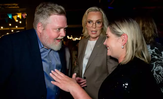 Former Icelandic Prime Minister and Centre Party leader Sigmundur Davíð Gunnlaugsson, left, Independence Party leader Guðrún Hafsteinsdóttir, center, and Progressive Party leader Lilja Dögg Alfreðsdóttir talk during a No campaign election-night gathering in Reykjavik, Iceland, Saturday, Aug. 29, 2026. (AP Photo/Marco Di Marco)