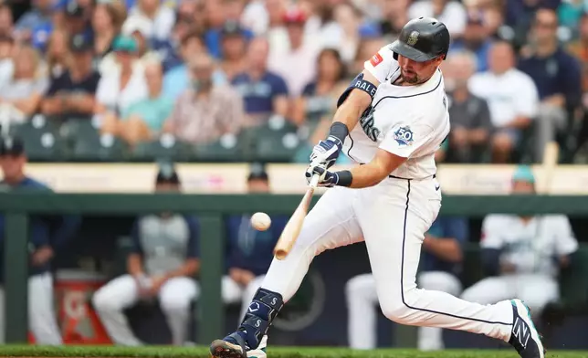 Seattle Mariners' Cal Raleigh hits a solo home run during the second inning of a baseball game against the Philadelphia Phillies, Tuesday, Aug. 25, 2026, in Seattle. (AP Photo/Lindsey Wasson)