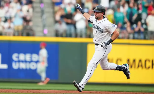 Seattle Mariners' Cal Raleigh jogs the bases after hitting a solo home run against the Philadelphia Phillies during the second inning of a baseball game, Tuesday, Aug. 25, 2026, in Seattle. (AP Photo/Lindsey Wasson)