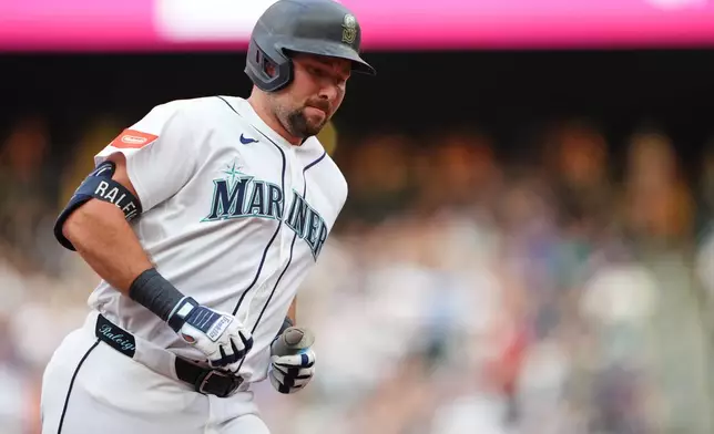 Seattle Mariners' Cal Raleigh jogs the bases after hitting a solo home run against the Philadelphia Phillies during the second inning of a baseball game, Tuesday, Aug. 25, 2026, in Seattle. (AP Photo/Lindsey Wasson)