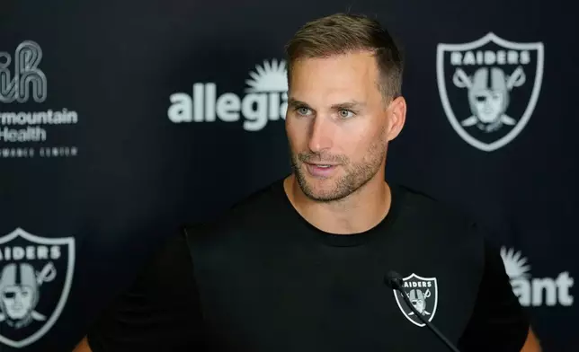 Las Vegas Raiders quarterback Kirk Cousins (8) speaks during a news conference at the team's NFL football training camp, Wednesday, July 29, 2026, in Henderson, Nev. (AP Photo/Lucas Peltier)