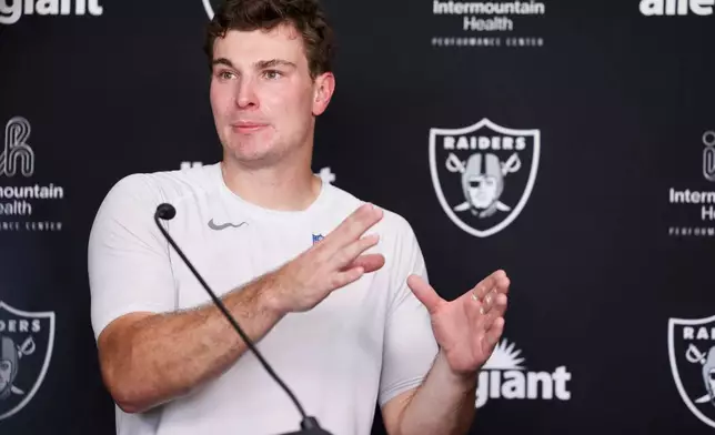 Las Vegas Raiders quarterback Fernando Mendoza (15) speaks during a news conference at the team's NFL football training camp, Thursday, July 30, 2026, in Henderson, Nev. (AP Photo/Ian Maule)