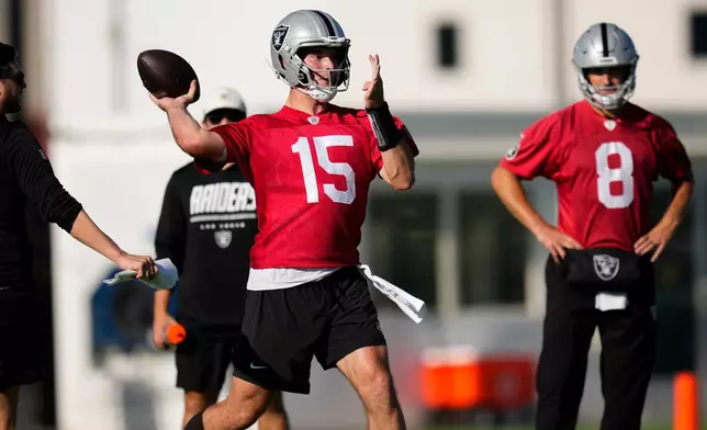 Las Vegas Raiders quarterback Fernando Mendoza (15) runs through a drill during practice at the team's NFL football training camp, Wednesday, July 29, 2026, in Henderson, Nev. (AP Photo/Lucas Peltier)