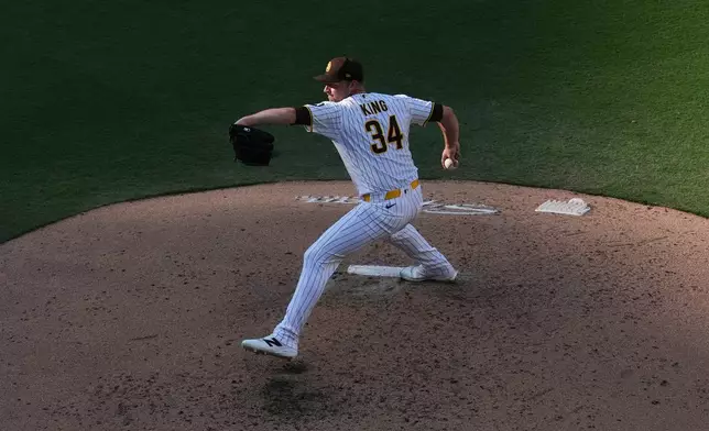 San Diego Padres pitcher Michael King works against a Houston Astros batter during the sixth inning of a baseball game Saturday, Aug. 8, 2026, in San Diego. (AP Photo/Gregory Bull)