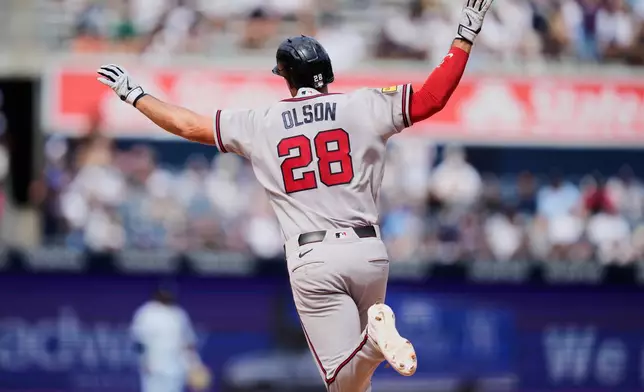 Atlanta Braves' Matt Olson reacts after hitting a solo home run during the seventh inning of a baseball game against the New York Yankees, Sunday, Aug. 9, 2026, in New York. (AP Photo/Seth Wenig)
