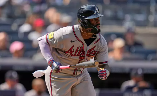 Atlanta Braves' Michael Harris II watches his RBI single during the 10th inning of a baseball game against the New York Yankees, Sunday, Aug. 9, 2026, in New York. (AP Photo/Seth Wenig)