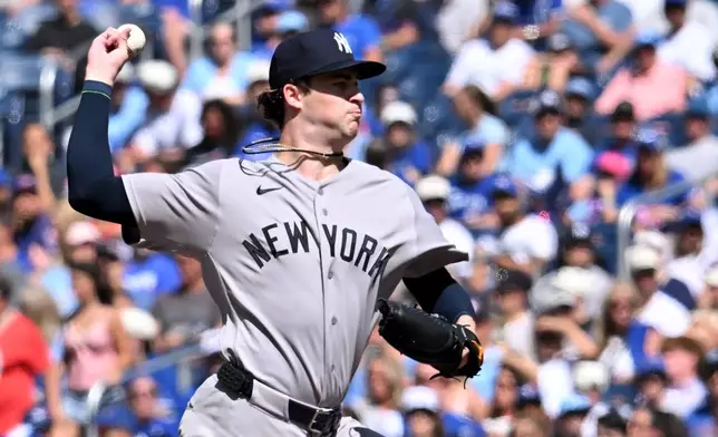 New York Yankees pitcher Cam Schlittler (31) throws to a Toronto Blue Jays batter during the first inning of a baseball game in Toronto, Saturday, Aug. 15, 2026. (Jon Blacker/The Canadian Press via AP)