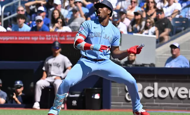 Toronto Blue Jays outfielder Jesus Sanchez (12) reacts to a called strike during the first inning of a baseball game in Toronto, Saturday, Aug. 15, 2026. (Jon Blacker/The Canadian Press via AP)