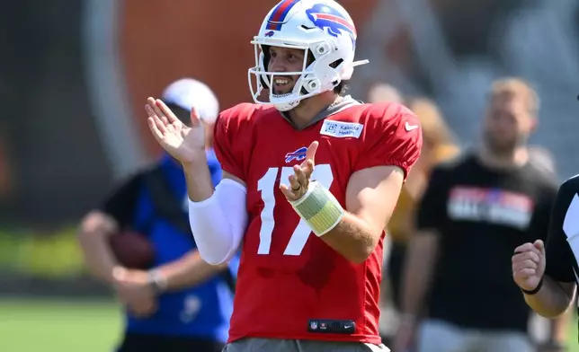 Buffalo Bills quarterback Josh Allen reacts after completing a pass during a joint NFL football practice with the Cleveland Browns in Berea, Ohio, Thursday, Aug. 20, 2026. (AP Photo/David Richard)