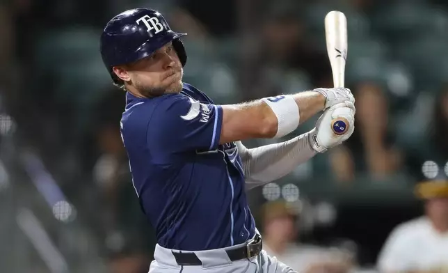 Tampa Bay Rays' Taylor Walls hits a two RBI single during the eighth inning of a baseball game against the Athletics Monday, Aug. 10, 2026, in West Sacramento, Calif. (AP Photo/Scott Marshall)