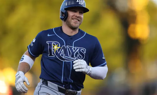 Tampa Bay Rays' Taylor Walls jogs around the bases after hitting a two-run home run during the fourth inning of a baseball game against the Athletics Tuesday, Aug. 11, 2026, in West Sacramento, Calif. (AP Photo/Scott Marshall)