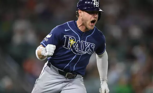 Tampa Bay Rays' Taylor Walls reacts as he heads towards first base on a two RBI single during the eighth inning of a baseball game against the Athletics Monday, Aug. 10, 2026, in West Sacramento, Calif. (AP Photo/Scott Marshall)