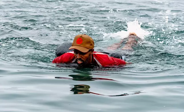 A migrant swims back to Morocco from the Spanish enclave of Ceuta on Friday 31 July 2026. (AP Photo/Antonio Sempere)