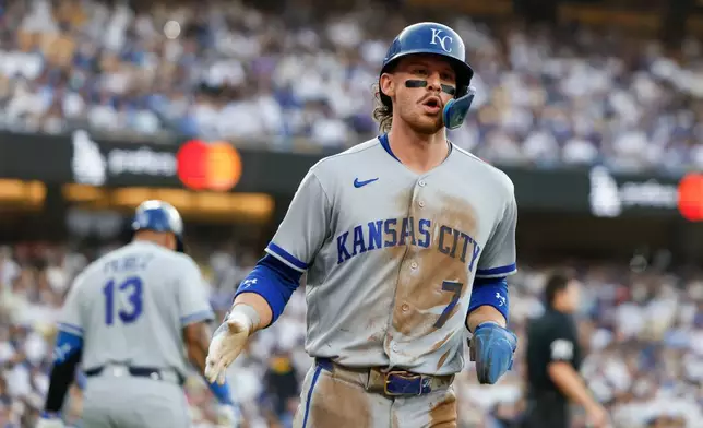 Kansas City Royals' Bobby Witt Jr. (7) runs past home plate after scoring on a single hit by Jac Caglianone (not shown) during the first inning of a baseball game against the Los Angeles Dodgers, Monday, Aug. 10, 2026, in Los Angeles. (AP Photo/Caroline Brehman)