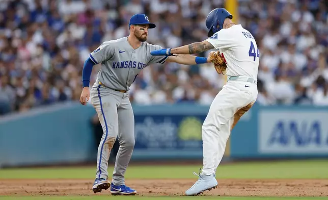 Kansas City Royals third baseman Nick Loftin, left, tags out Los Angeles Dodgers' Andy Pages, right, during the first inning of a baseball game Monday, Aug. 10, 2026, in Los Angeles. (AP Photo/Caroline Brehman)