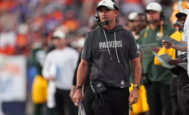 Green Bay Packers head coach Matt LaFleur looks toward the field against the Denver Broncos during the first half of an NFL preseason football game Friday, Aug. 21, 2026, in Denver. (AP Photo/David Zalubowski)