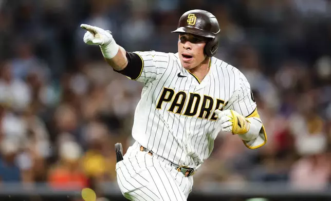 San Diego Padres' Freddy Fermin gestures towards the dugout after hitting a single against the Pittsburgh Pirates in the third inning of a baseball game Monday, Aug. 24, 2026, in San Diego. (AP Photo/Derrick Tuskan)