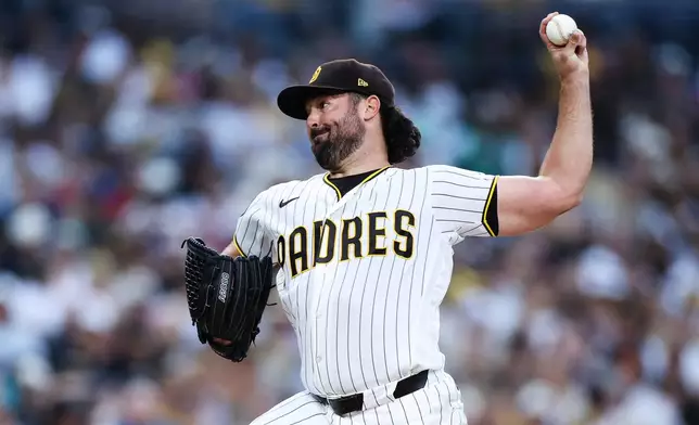San Diego Padres' Robbie Ray winds up against a Pittsburgh Pirates batter in the second inning of a baseball game Monday, Aug. 24, 2026, in San Diego. (AP Photo/Derrick Tuskan)
