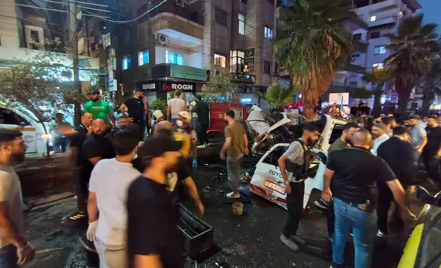 First responders and security personnel are seen at the site of an explosion in the Jaramana suburb of Damascus, Syria, Thursday, Aug. 6, 2026. (AP Photo/Abdulrahman Shaheen)