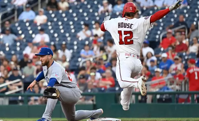 Chicago Cubs first baseman Michael Busch catches the ball for an out before Washington Nationals' Michael Busch (12) can reach first base during the third inning of a baseball game, Wednesday, Aug. 12, 2026, in Washington. (AP Photo/John McDonnell)