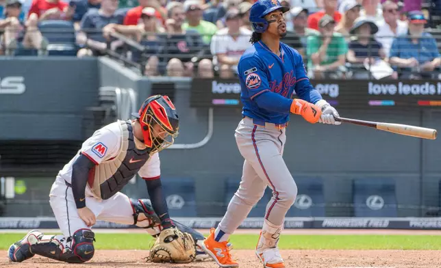 New York Mets' Francisco Lindor watches his three-run home run off Cleveland Guardians relief pitcher Craig Yoho as catcher Patrick Bailey looks down during the seventh inning of a baseball game, Thursday, Aug. 6, 2026, in Cleveland. (AP Photo/Phil Long)
